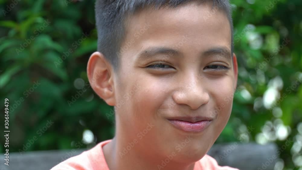 Closeup of Boy Smiling and Looking to Camera Closeup of Boy Smiling and Looking to Camera