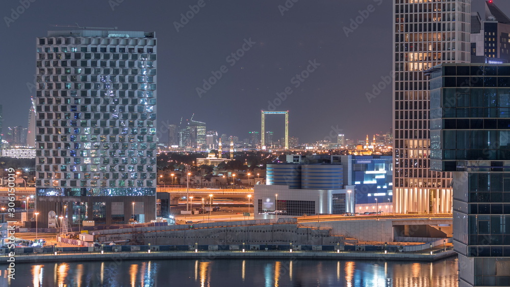 Bright night in Dubai near canal aerial timelapse Bright night in Dubai near canal aerial timelapse