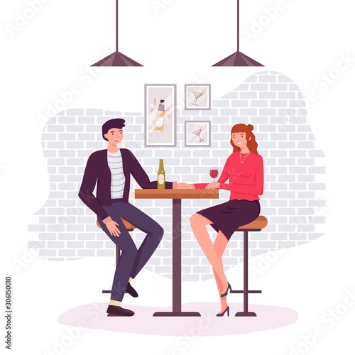 Couple at the table talking and drinking beer in pub, cafe. Man and woman spending friday leisure time together. Friendly beer party, festival scene. Romantic date at the bar. Bar table and chairs.