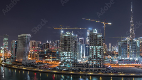 Fototapeta Naklejka Na Ścianę i Meble -  The rhythm of the city of Dubai near canal aerial timelapse