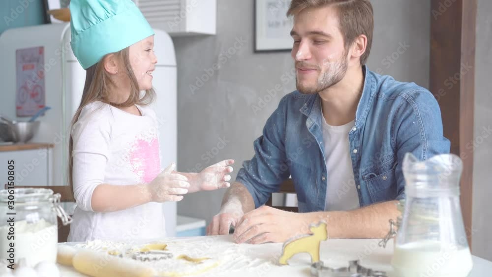 family activities: dad teach daughter to cook bakery. weekend hobby family love concept family activities: dad teach daughter to cook bakery. weekend hobby family love concept