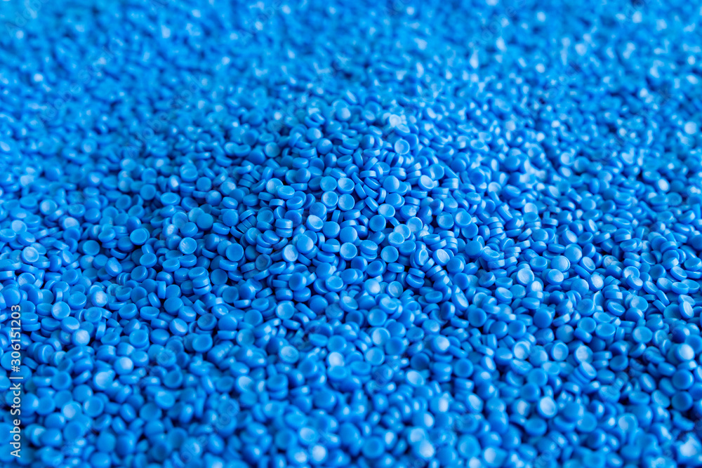 Obraz premium Close-up of plastic polymer granules. hand hold Polymer pellets. polymer plastic. compound polymer.