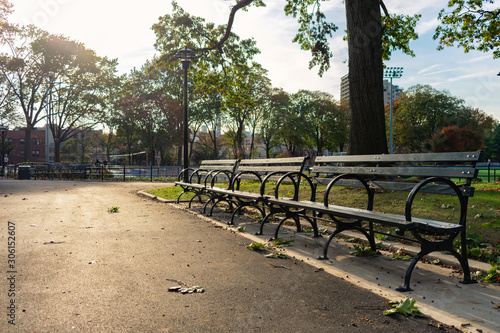 Fotografering Row of Empty Wooden Benches at Astoria Park in Queens New York