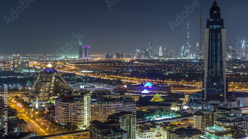 Aerial view of the rhythm illuminated city with lights of Dubai aerial timelapse