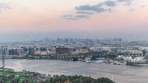 View of new modern city with green trees in luxury Dubai city, United Arab Emirates Timelapse Aerial