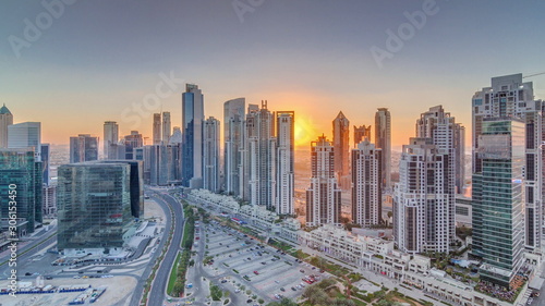 Modern residential and office complex with many towers aerial timelapse at Business Bay  Dubai  UAE.
