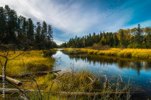 A peaceful section of river above the falls at Rushing River located near the town of Kenora in Northwest Ontario, Canada.