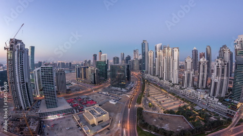 Panorama of Business bay Dubai night to day aerial timelapse.