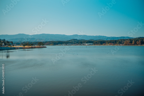 Wallpaper Mural Calm surface of lake and long shot of layered mountains at Gangneung, South Korea Torontodigital.ca