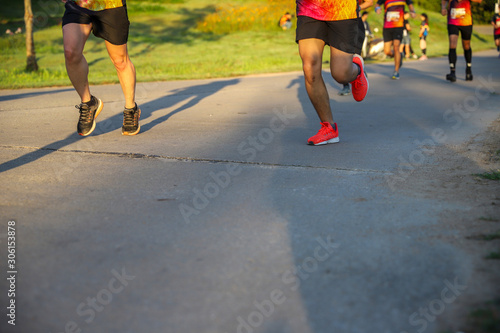 Summer running race in the park, people running © aumnat