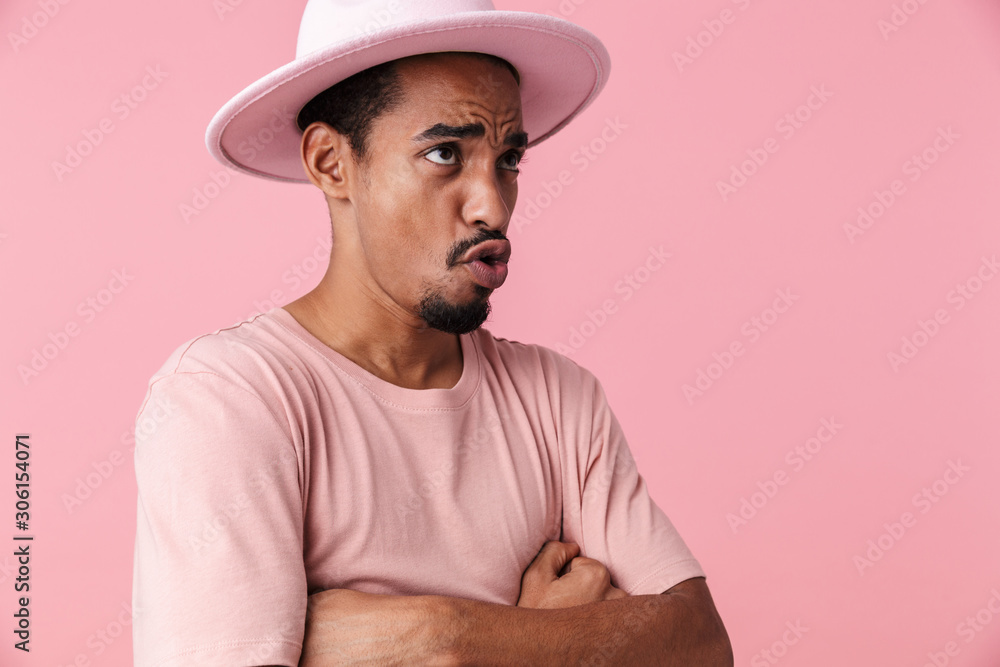 Photo of resentful african american man posing with hands crossed Photo of resentful african american man posing with hands crossed