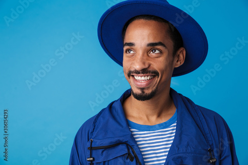 Photo of funny african american man smiling and looking upward