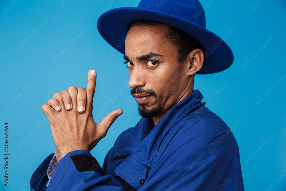 Photo of serious african american man making gun gesture Photo of serious african american man making gun gesture