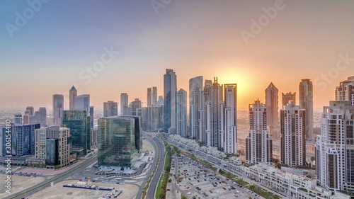 Modern residential and office complex with many towers aerial timelapse at Business Bay, Dubai, UAE. © neiezhmakov