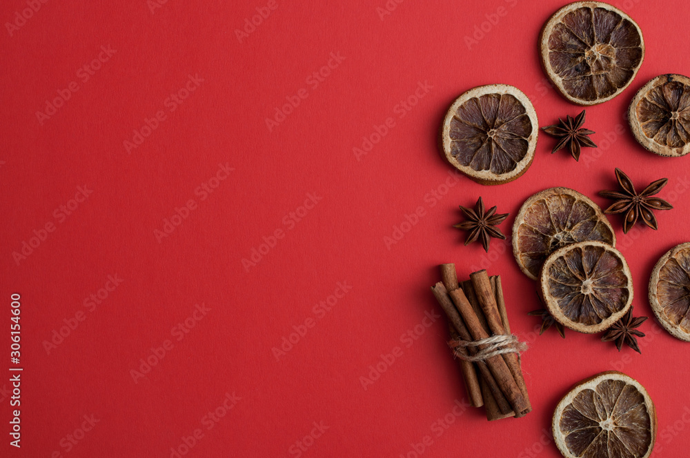 Christmas red background with dry dehydrated spices