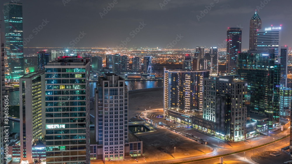 Dubai's business bay towers aerial night timelapse. Dubai's business bay towers aerial night timelapse.