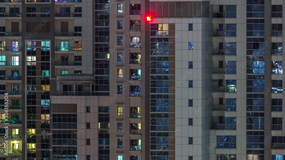 Lights from windows of offices in Dubai Aerial Timelapse