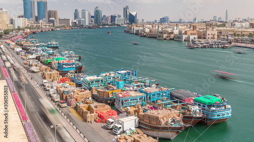 Loading a ship in port timelapse in Dubai, Deira creek, UAE.