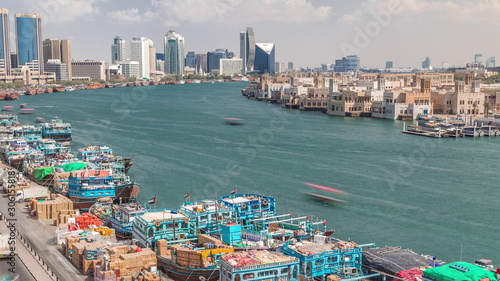 Loading a ship in port timelapse in Dubai, Deira creek, UAE. © neiezhmakov