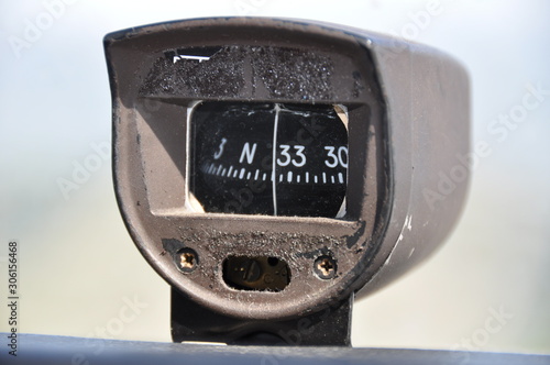 Magnetic compass instrument in airplane cockpit, single piston aeroplane photo