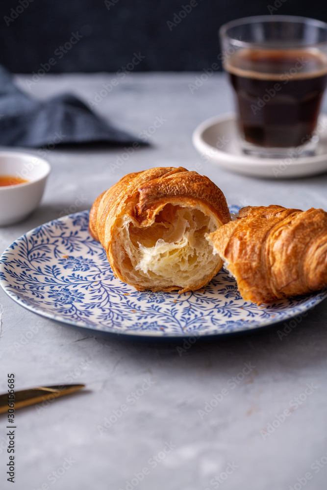 Breakfast with croissant and black coffee Breakfast with croissant and black coffee