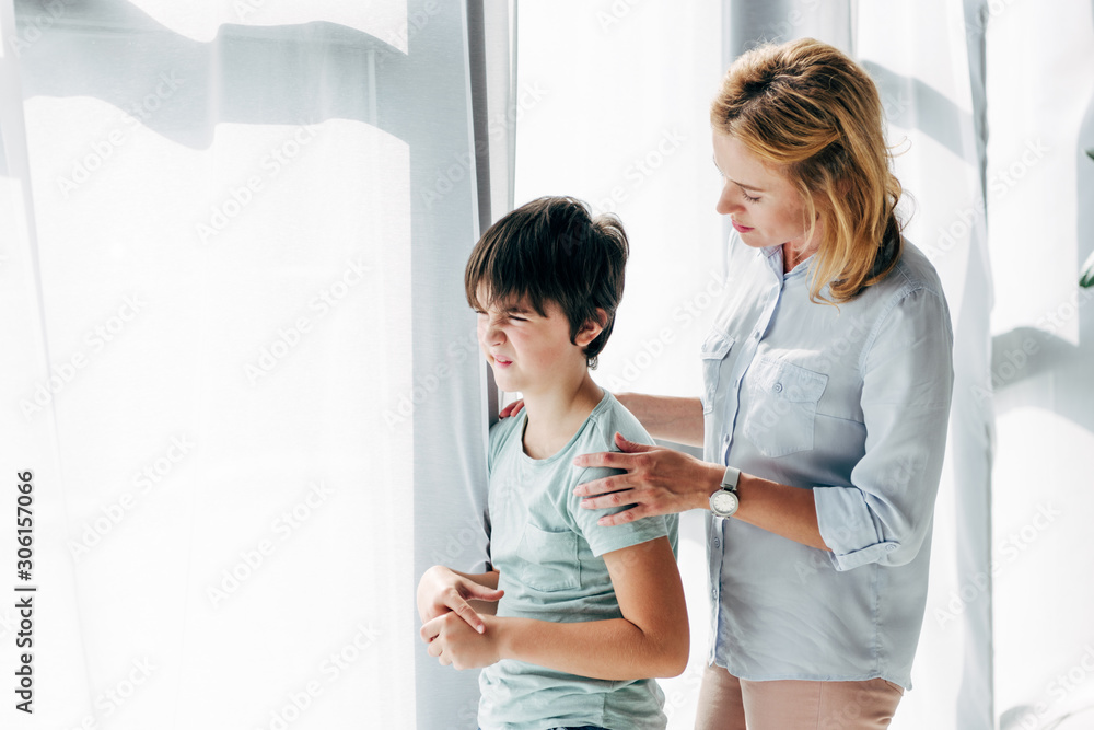 child psychologist hugging and talking to kid with dyslexia child psychologist hugging and talking to kid with dyslexia
