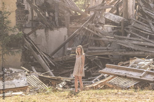 A woman looks at a blockage from the building.