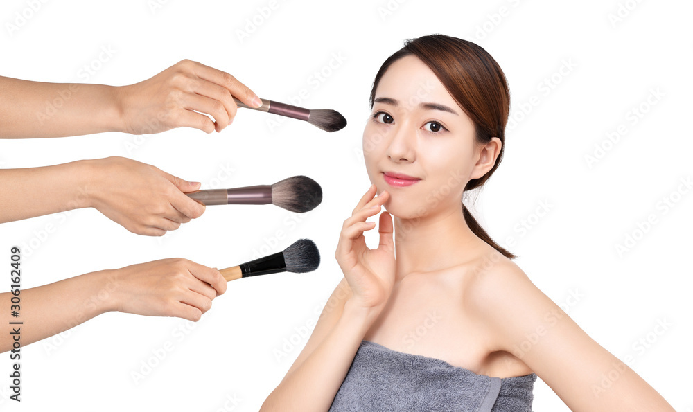 Portrait of beautiful woman with make-up brushes on white background Portrait of beautiful woman with make-up brushes on white background