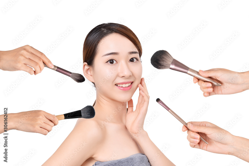 Portrait of beautiful woman with make-up brushes on white background Portrait of beautiful woman with make-up brushes on white background