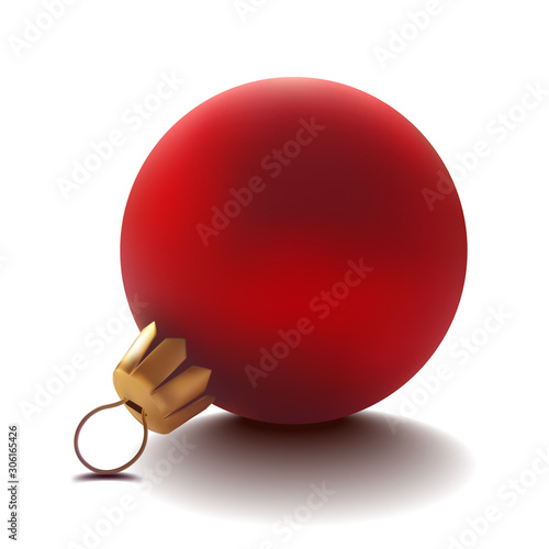 Red glass Christmas ball is lying on the table