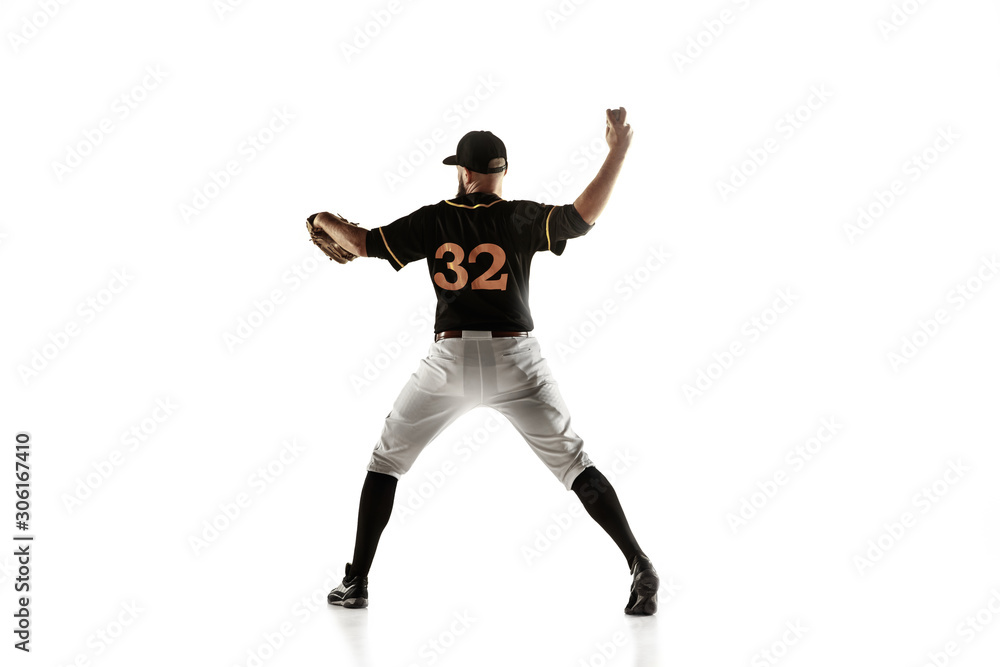 Baseball player, pitcher in a black uniform practicing and training isolated on a white background. Young professional sportsman in action and motion. Healthy lifestyle, sport, movement concept. Baseball player, pitcher in a black uniform practicing and training isolated on a white background. Young professional sportsman in action and motion. Healthy lifestyle, sport, movement concept.