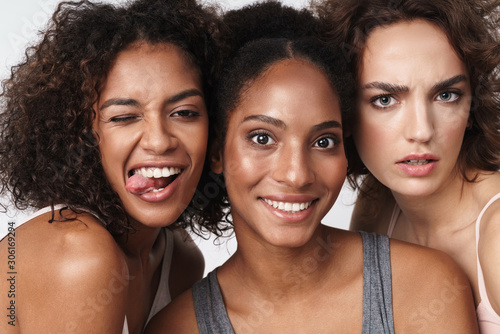 Portrait of multiracial women standing together and looking at camera