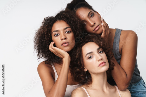 Portrait of multiethnic women standing together and looking at camera