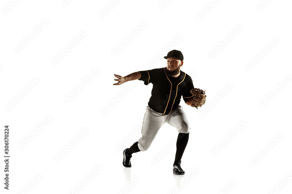 Baseball player, pitcher in a black uniform practicing and training isolated on a white background. Young professional sportsman in action and motion. Healthy lifestyle, sport, movement concept. Baseball player, pitcher in a black uniform practicing and training isolated on a white background. Young professional sportsman in action and motion. Healthy lifestyle, sport, movement concept.