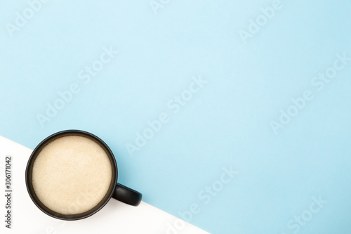 Flatlay coffee on a blue-white background. With copy space