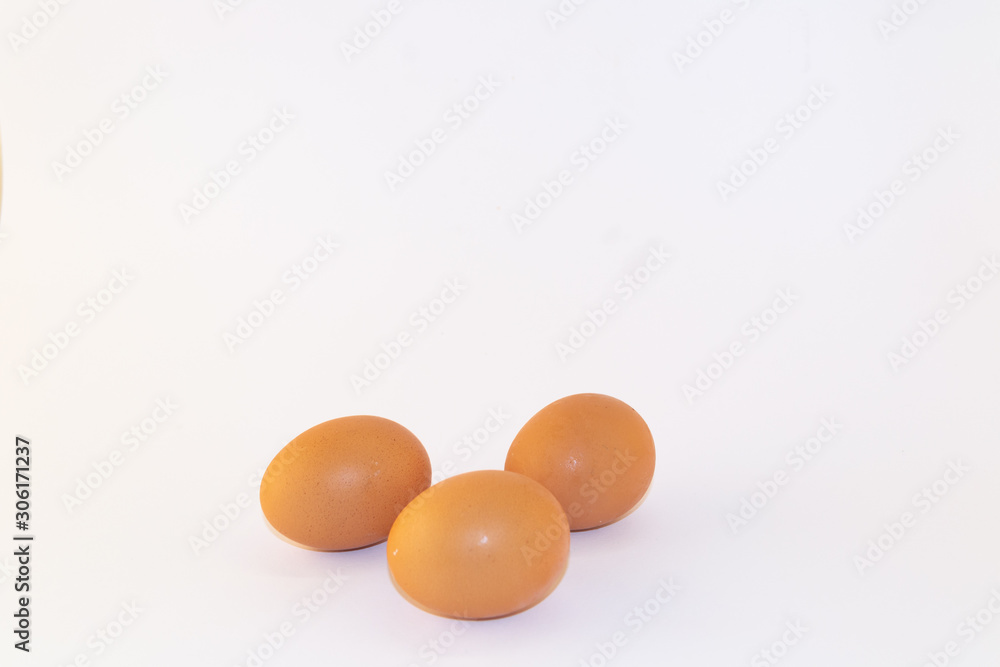 Three chicken eggs isolated on white background. Studio shot Three chicken eggs isolated on white background. Studio shot