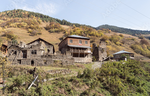 A single farm is located at the foot of the mountains in Svaneti in the mountainous part of Georgia in the early morning