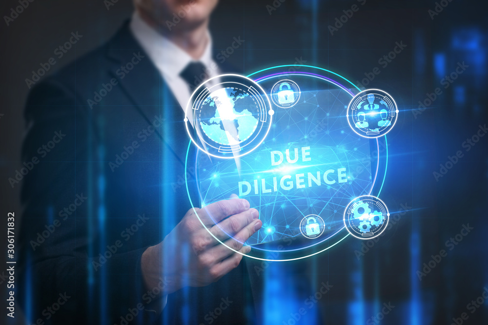 Obraz premium Business, Technology, Internet and network concept. Young businessman working on a virtual screen of the future and sees the inscription: Due diligence