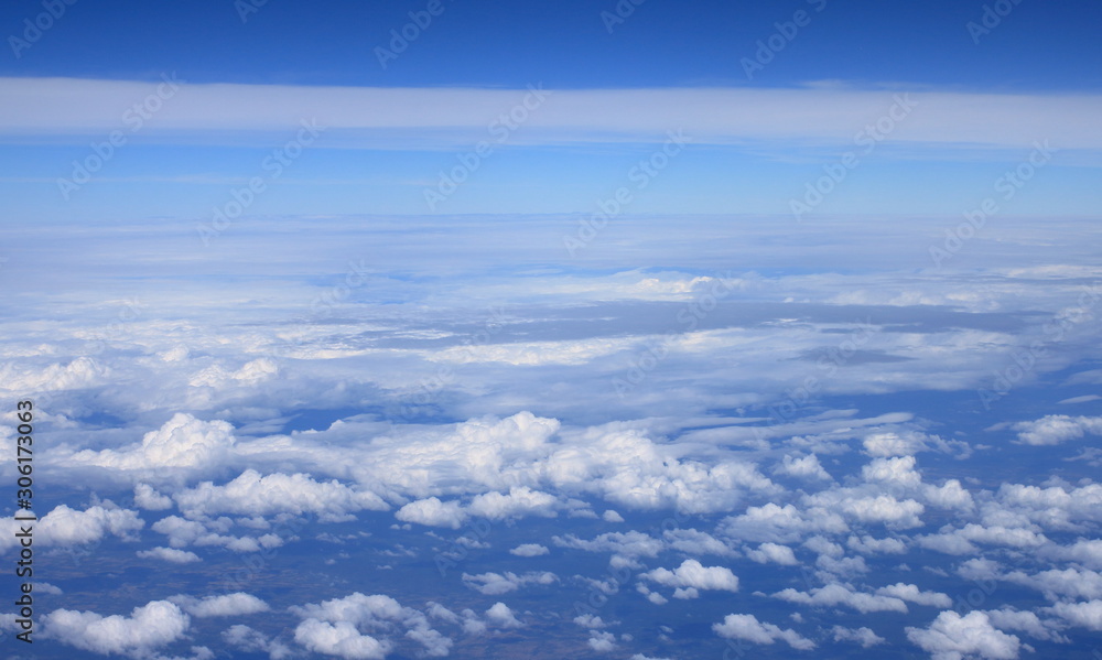 Blue sky and clouds, View from window of airplane.