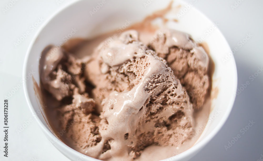 Melting chocolate ice cream in a white ceramic cup Melting chocolate ice cream in a white ceramic cup