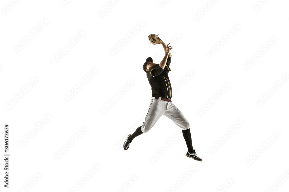 In jump. Baseball player, pitcher in black uniform practicing and training isolated on white background. Young professional sportsman in action and motion. Healthy lifestyle, sport, movement concept.