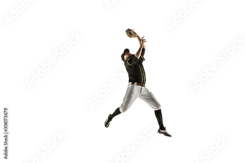 In jump. Baseball player  pitcher in black uniform practicing and training isolated on white background. Young professional sportsman in action and motion. Healthy lifestyle  sport  movement concept.