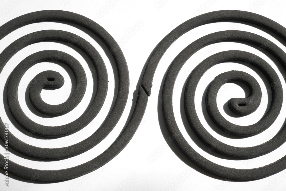 Naklejka premium Mosquito repellent incense coil black on white background