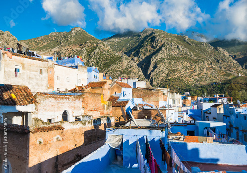 Chefchaouen view with blue roofs and mountains on background © leelook
