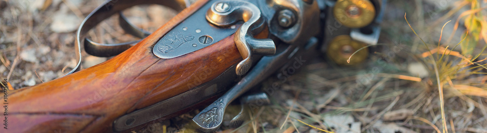 Hunting rifle on grass. The beginning of the hunting season is open. For pheasant and birds. Hunting rifle on grass. The beginning of the hunting season is open. For pheasant and birds.