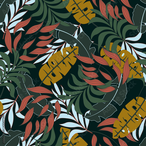 Summer seamless tropical pattern with bright yellow and green plants and leaves on a dark background. Vector design. Jungle print. Floral background. Printing and textiles. 