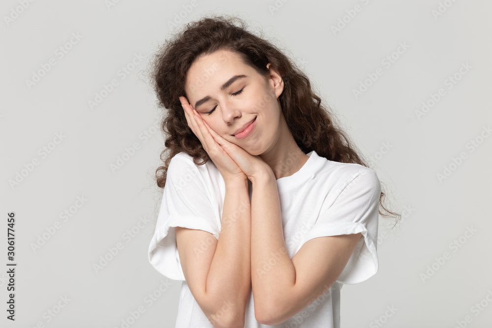 Calm girl isolated in studio rest sleep peacefully on hands Calm girl isolated in studio rest sleep peacefully on hands