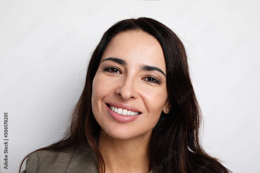 Young and beautiful woman smiling and posing on the pink background. Isolated. Young and beautiful woman smiling and posing on the pink background. Isolated.