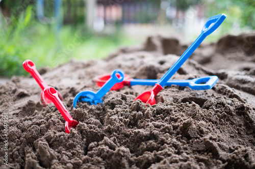 colorful sand box toys for kids in sand box after kids playing, kids and baby concept. © wirul