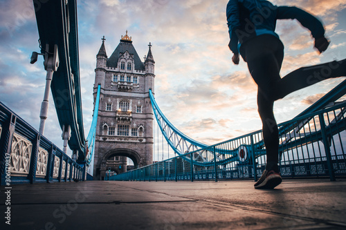 running in London Concept photo. Man running on Tower bridge. London Marathon photo